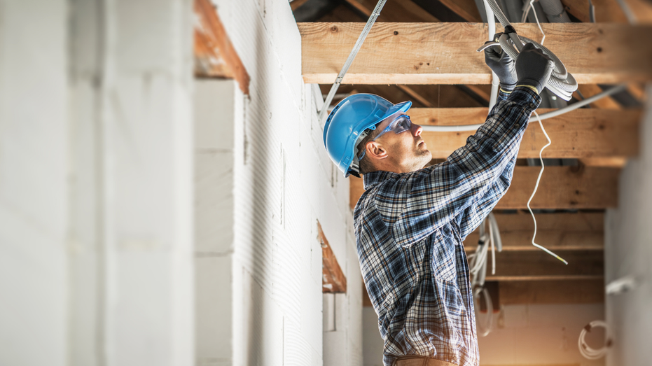 An electrician working in a new home