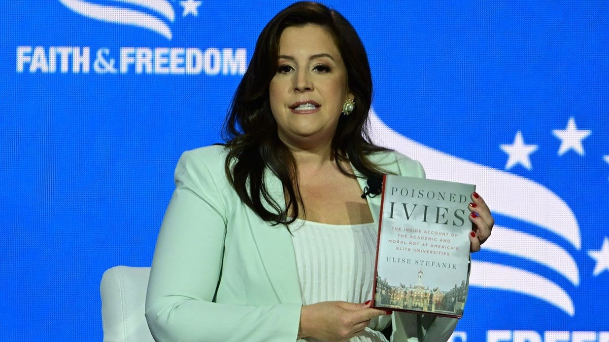 Elise Stefanik holds her book