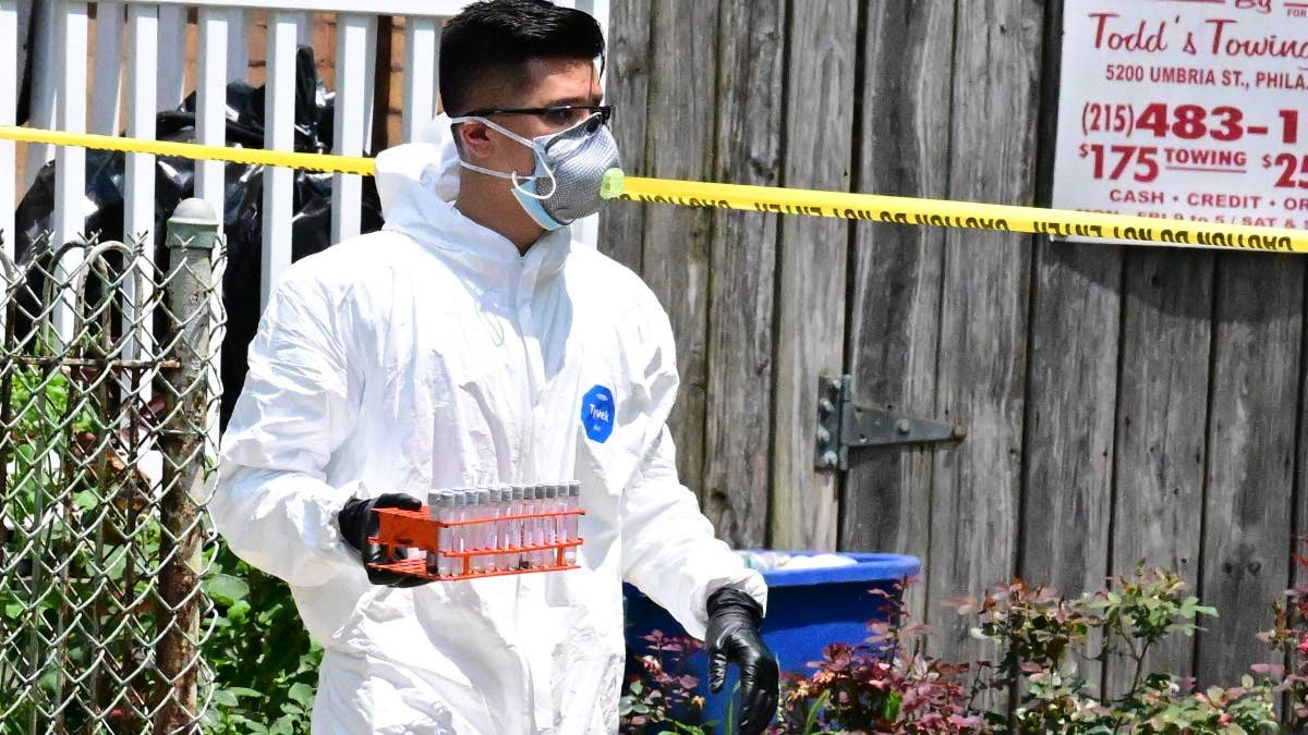 FBI agents remove evidence from Eugene Horsch's home during a raid in Philadelphia.