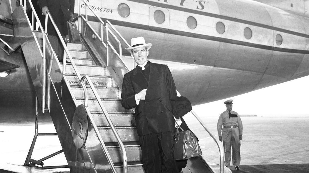 Fulton Sheen getting off a plane