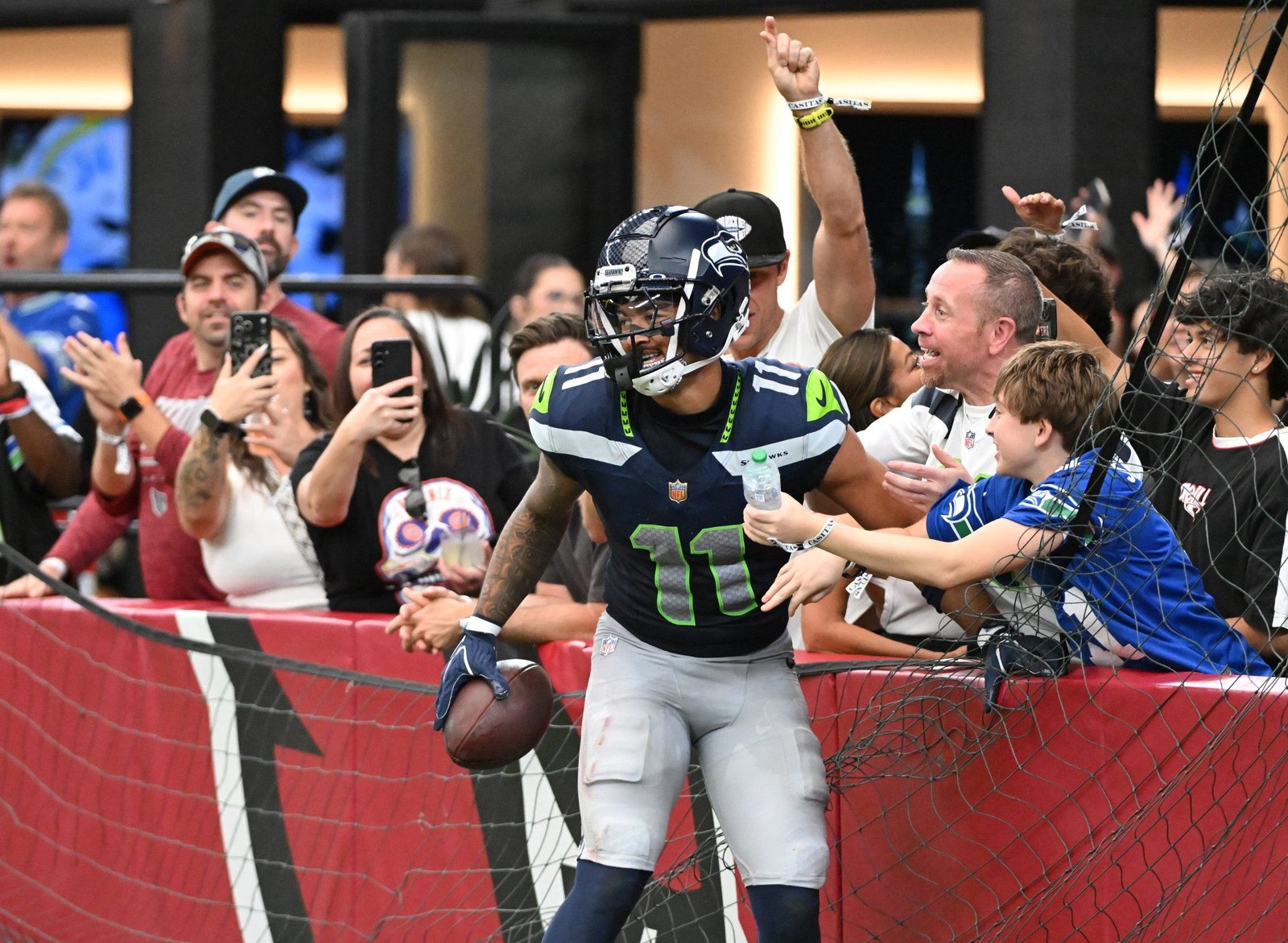 Jaxon Smith-Njigba caught nine passes for 155 yards and a career-high three touchdowns in a 31-7 win over the Arizona Cardinals. (Photo by Norm Hall/Getty Images)