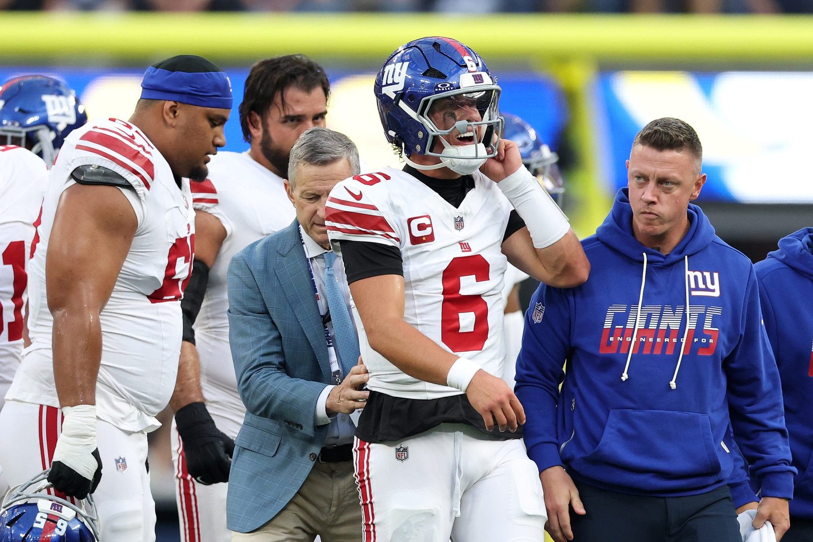 Jaxson Dart walks off the field after suffering a knee injury in the first quarter against the Los Angeles Rams. (Harry How/Getty Images)
