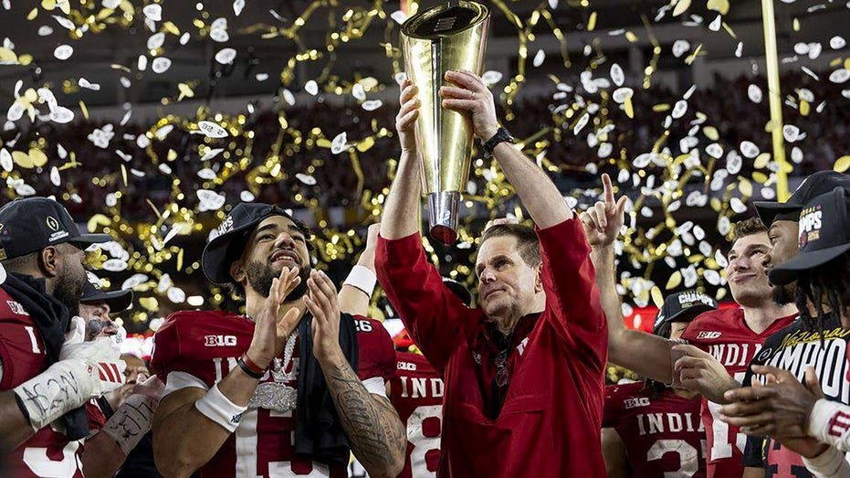 Indiana head coach Curt Cignetti celebrates a national title