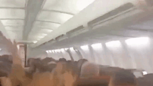 Plane passengers scream in harrowing mid-flight video as violent shaking sends cabin ceiling panels flying Plane passengers scream in harrowing mid-flight video as violent shaking sends cabin ceiling panels flying