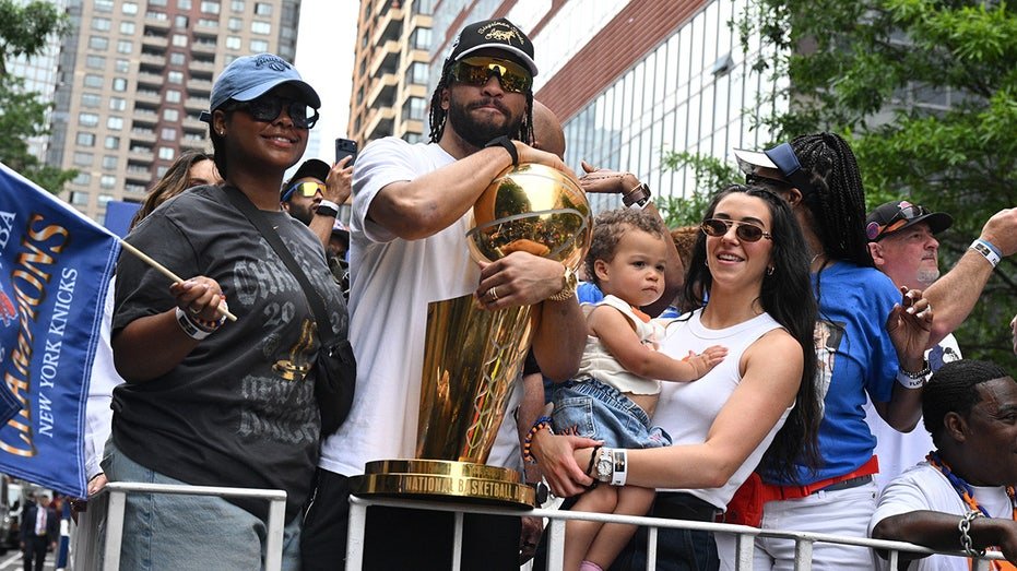 Jalen Brunson with Finals trophy