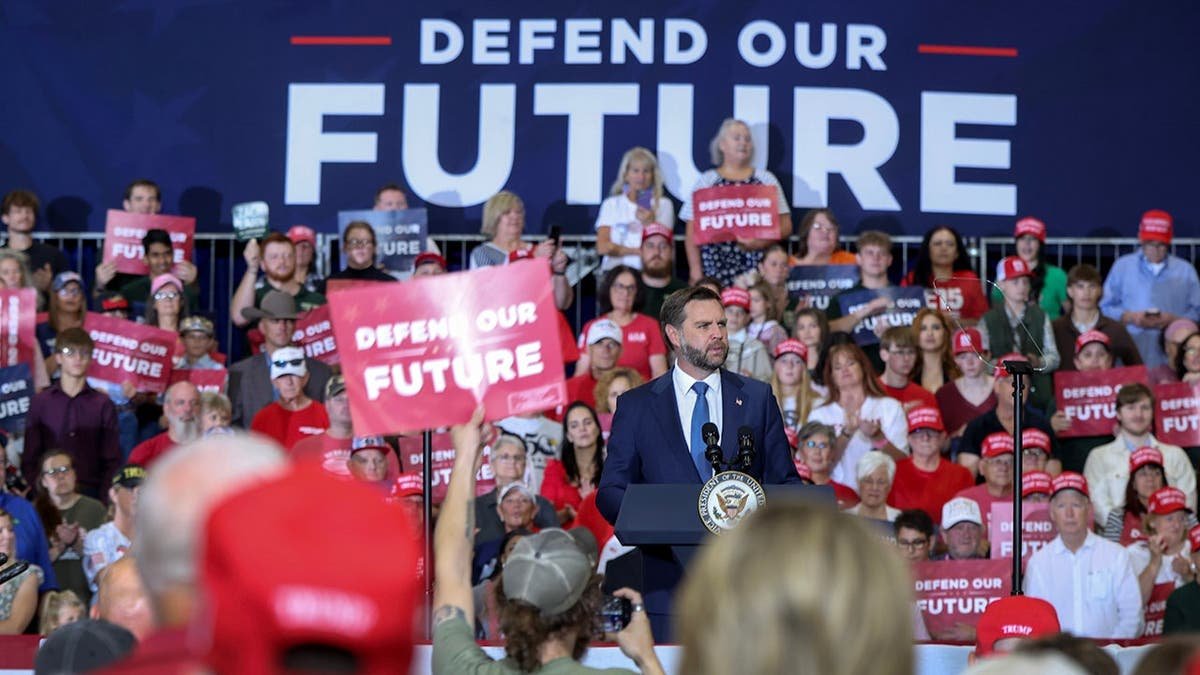 Vice President JD Vance speaks at a podium during a Republican National Committee rally.