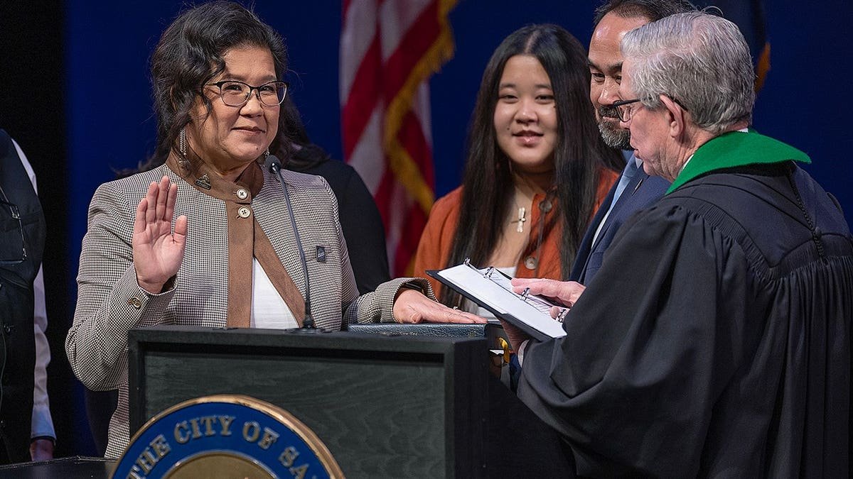 Kaohly Her is sworn in as St. Paul's first Hmong and first woman mayor during a ceremony.