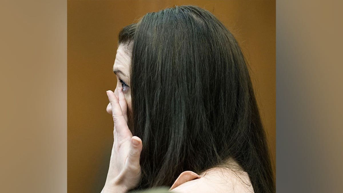 Lindsay Clancy wipes away tears while listening to testimony in court.