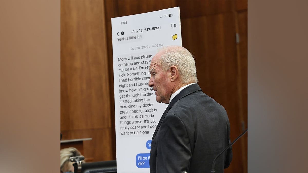 Attorney Kevin Reddington holds up a display board during Lindsay Clancy's murder trial in Plymouth Superior Court.