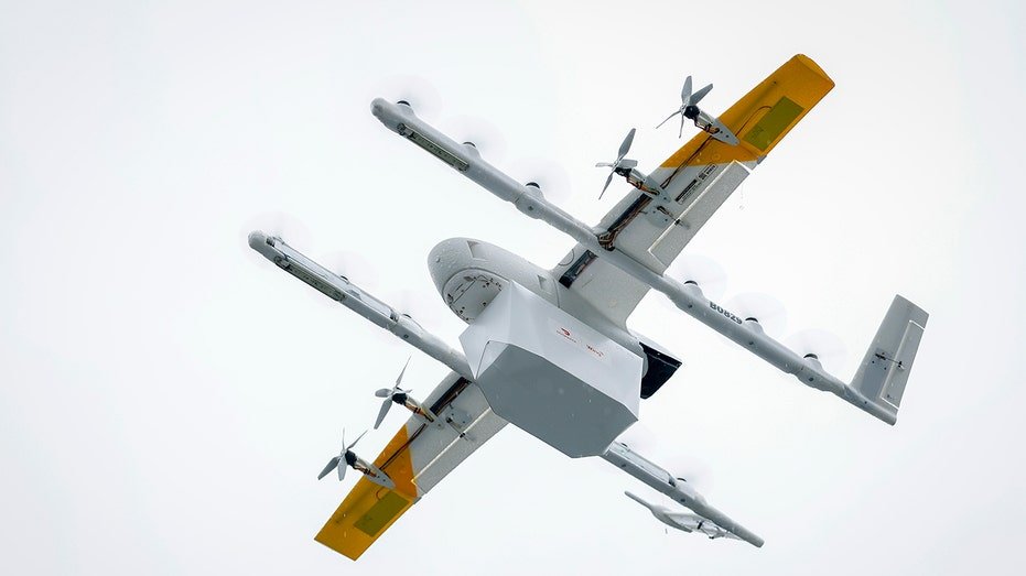A Wing drone operated through DoorDash flies from a Lowe’s store