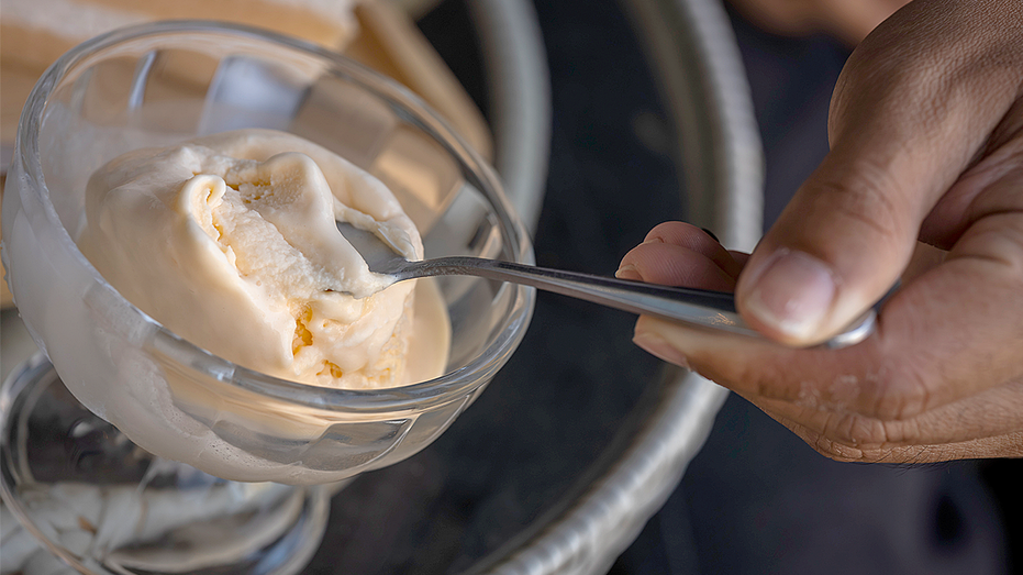 Man eating a frozen dessert from a bowl