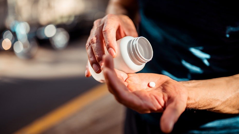 A person taking medication.