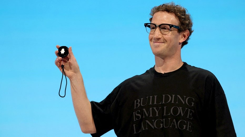 Meta CEO Mark Zuckerberg holds a Muse charm.