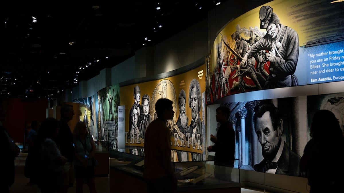 Visitors listen to a tour inside the Museum of the Bible in Washington, D.C.