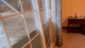 Dramatic video captures floodwaters bursting through glass doors of college students’ home Dramatic video captures floodwaters bursting through glass doors of college students’ home