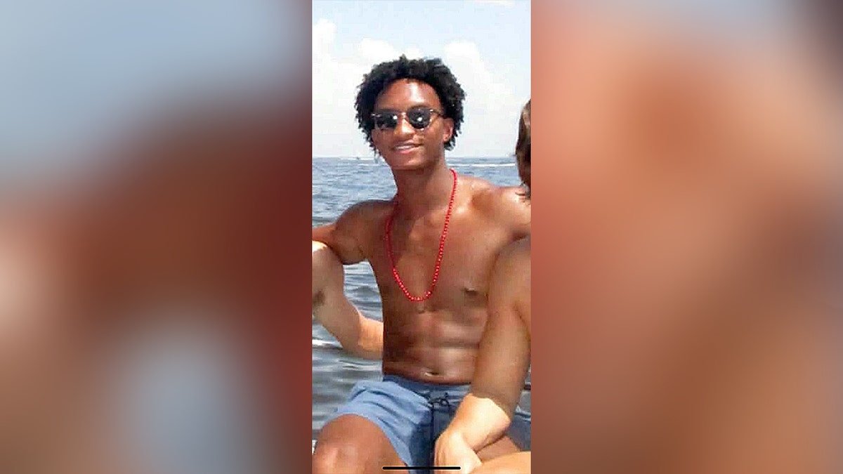 Man on boat wearing sunglasses.