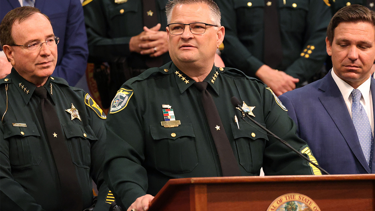 Sheriff Grady Judd beside Sheriff Wayne Ivey and Gov. Ron DeSantis
