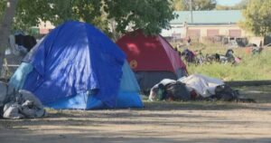 ‘Aggressive protestors’ force Saskatoon to halt encampment clean-up, city says