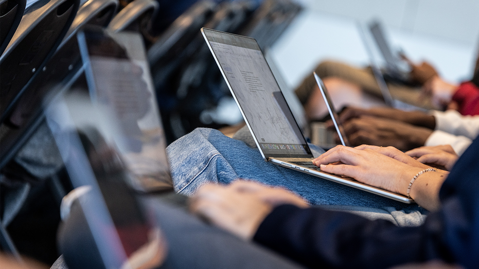 Students use laptops.