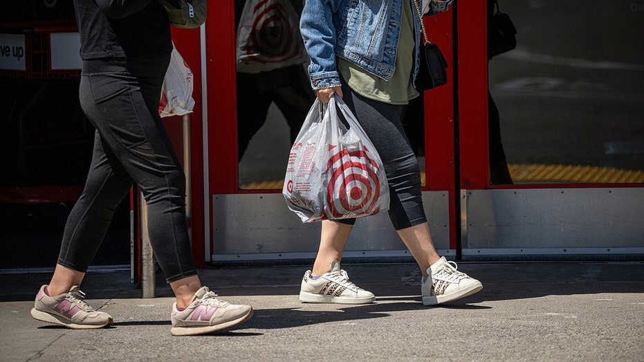 Target customers walk out with bags in hand