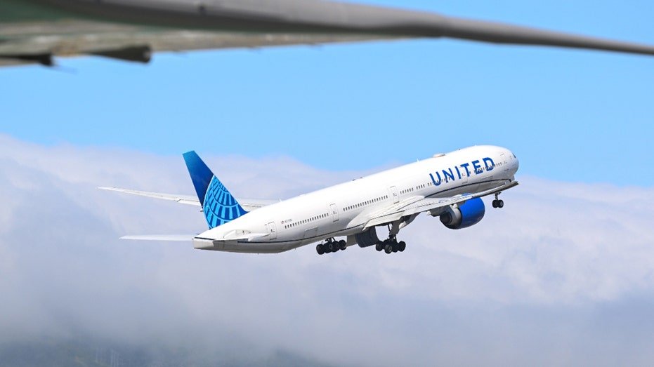 A United Airlines plane takes off at