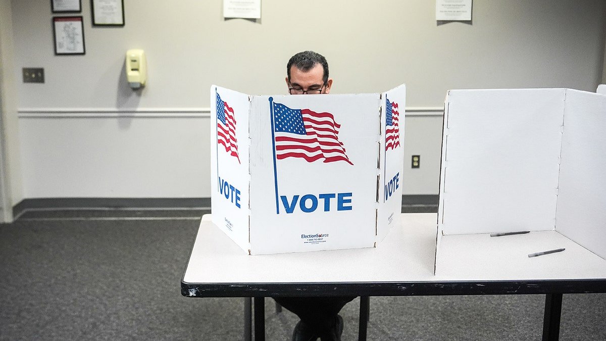 A person casting a ballot at the Fairfax Government Center in Virginia.