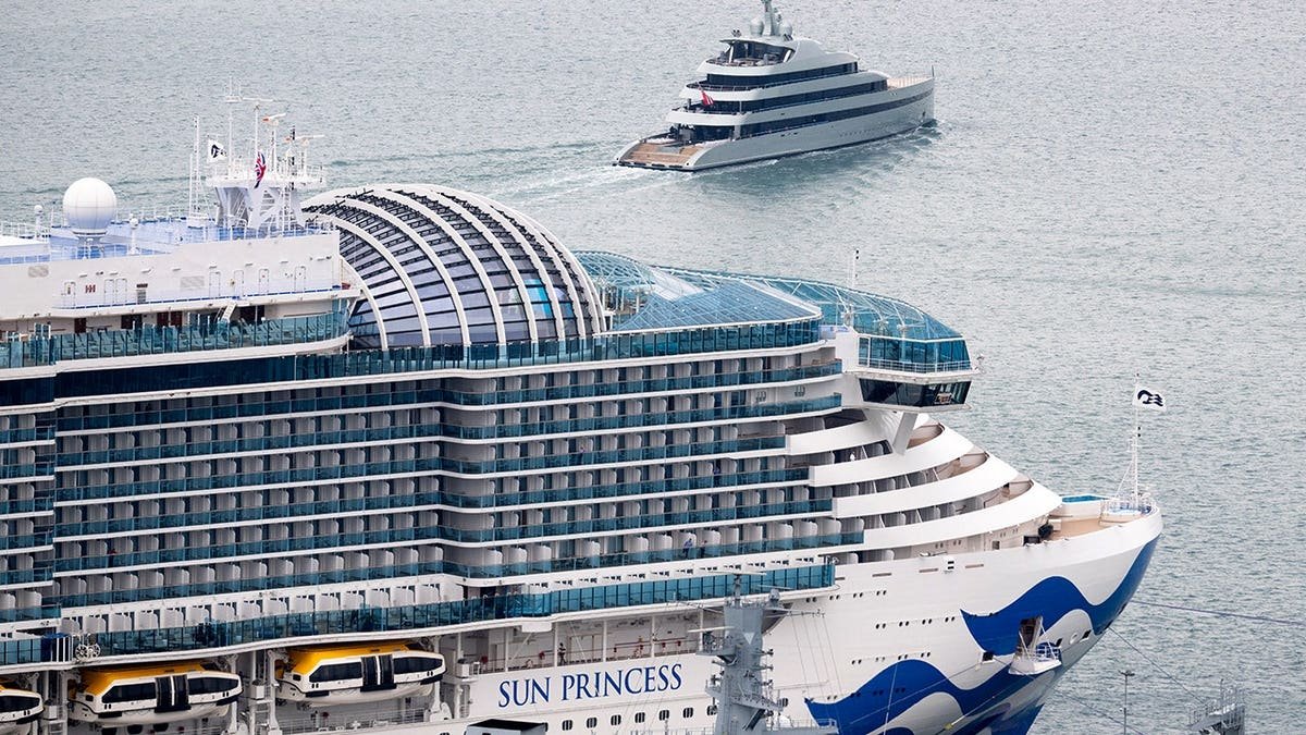 Film crews and actors work on the super-yacht Savannah near the cruise ship Sun Princess in Portland Port.